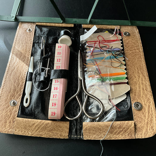 Sensational vintage sewing kit in stitched embossed with sewing notion graphic leather case