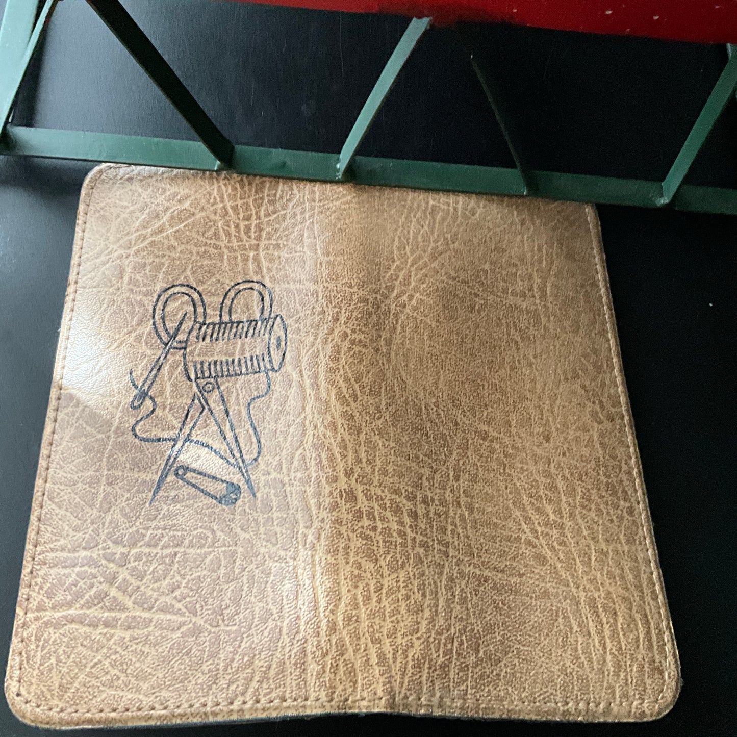 Sensational vintage sewing kit in stitched embossed with sewing notion graphic leather case