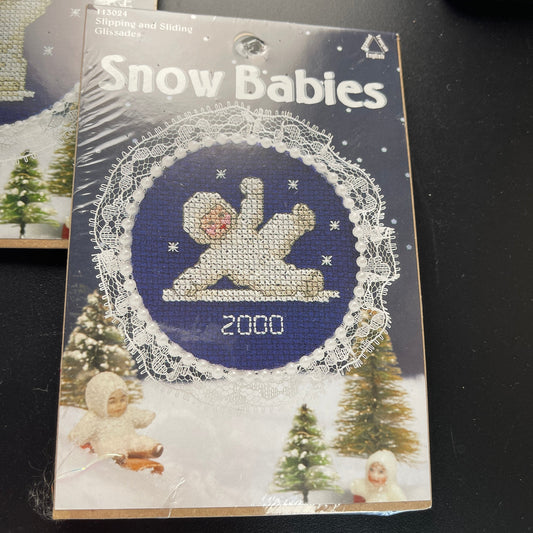 Leisure Arts Snow Babies Set of 2 Slipping and Sliding and It's Snowing! Counted Cross Stitch Kits