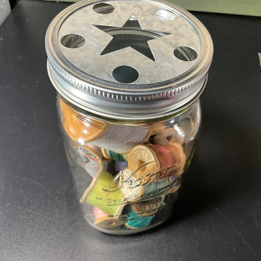 Knorr metal star cutout lidded jar full of vintage needlecraft notions decorative collectible