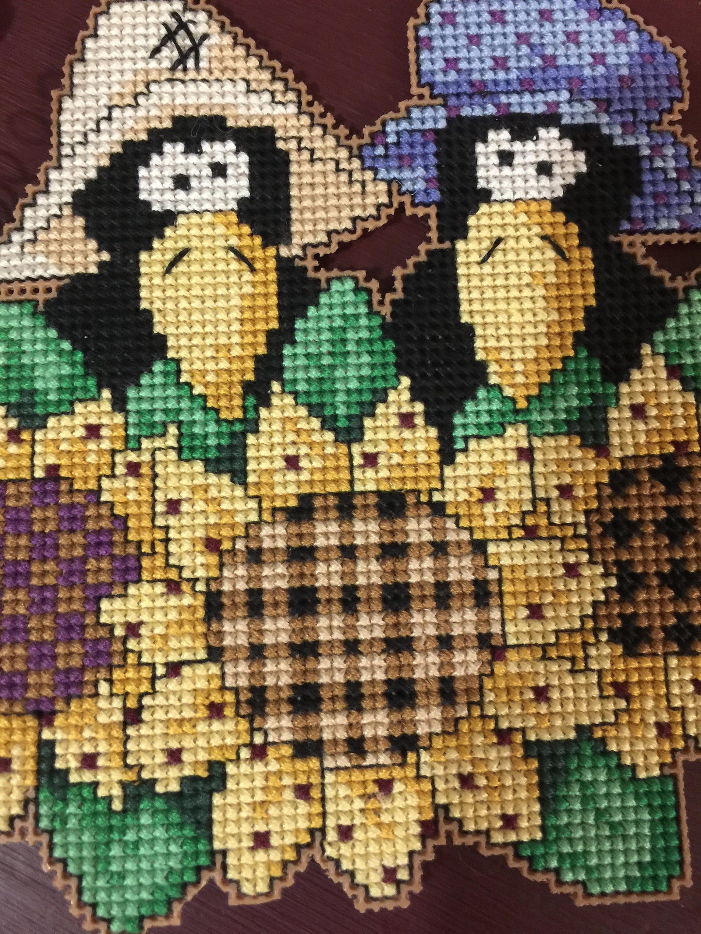 Ma and Pa Crows in the Sunflowers, stitched wall hanging embellished with little hearts and bow