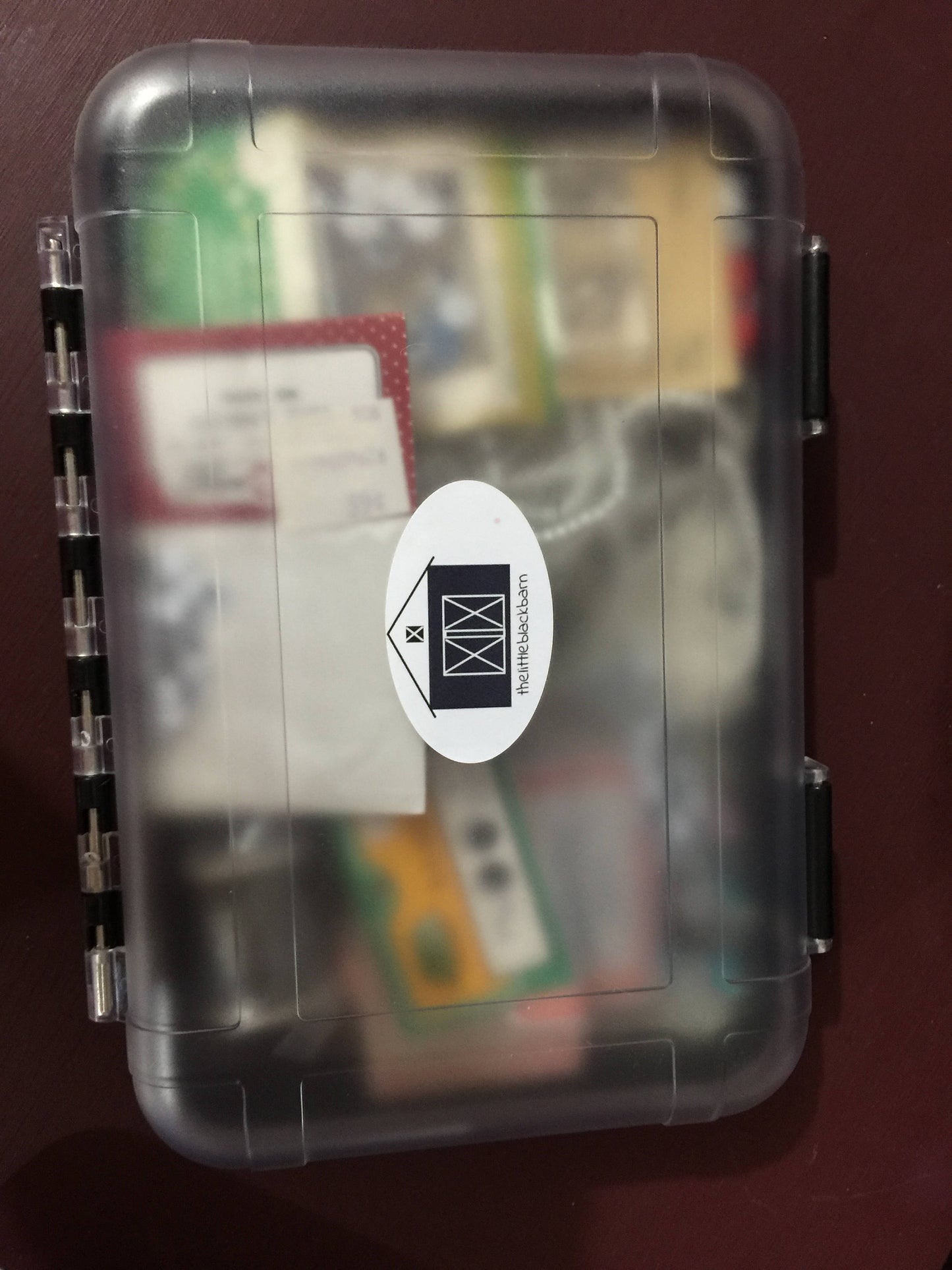 Beady looking eyes and pearly looking beads even hooks and eyes in a great durable project container