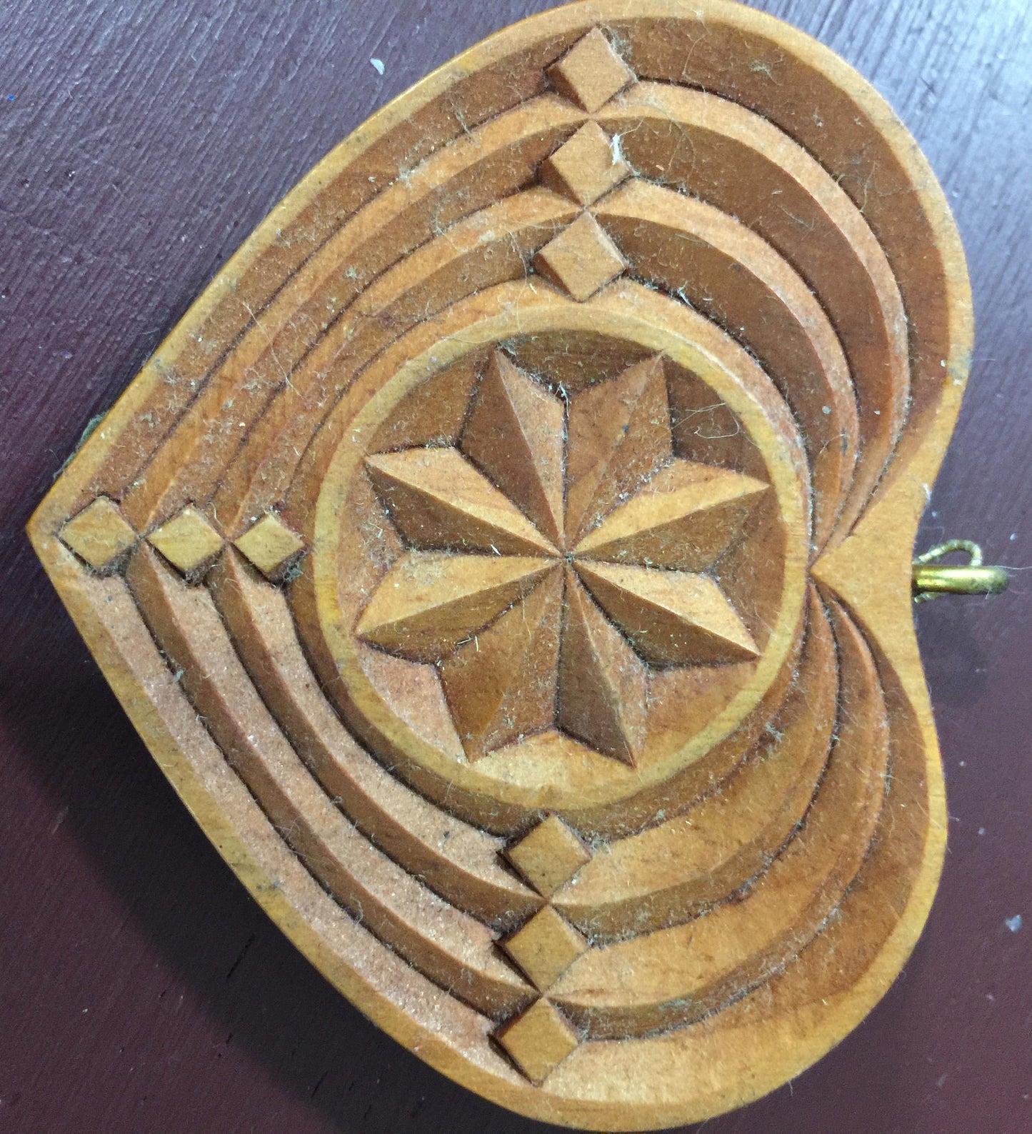 Carved wood ornament signed by M. Stryker, Vintage 1995