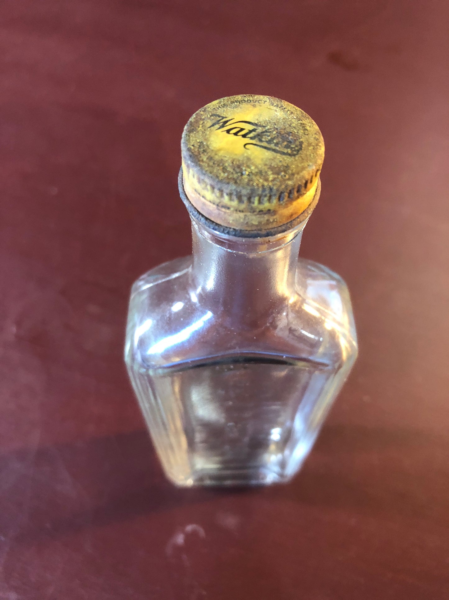 The J.R. Watkins, Vintage Collectible Clear Rectangular, Liniment Bottle with matching metal screw cap imprinted with Watkins