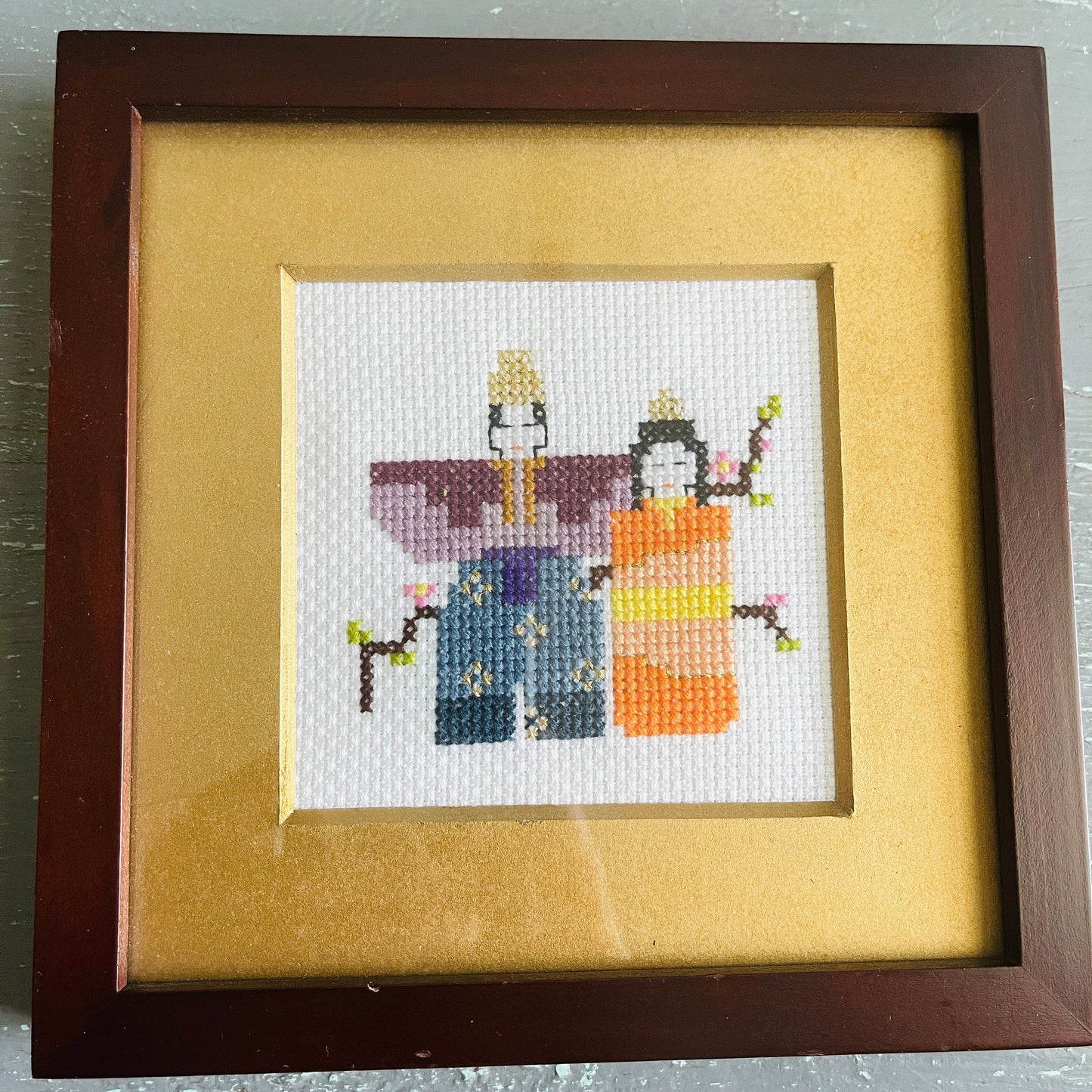 Oriental couple, finished counted cross stitch project, with gold mat and nice solid wood frame