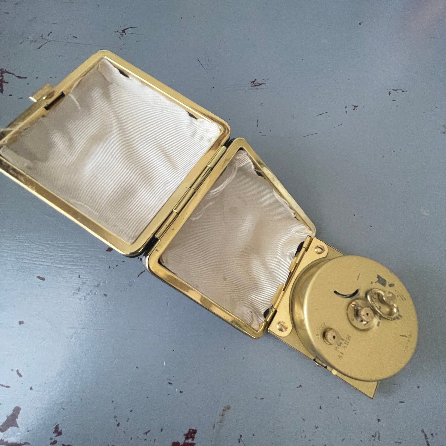 Westclox mechanical wind up travel alarm clock in gold-tone numbers and trim in dark brown case vintage collectible keepsake