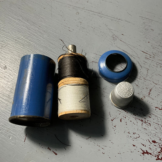 Tin can vintage sewing kit with wooden spools of thread metal thimble and needles needlecraft collectible