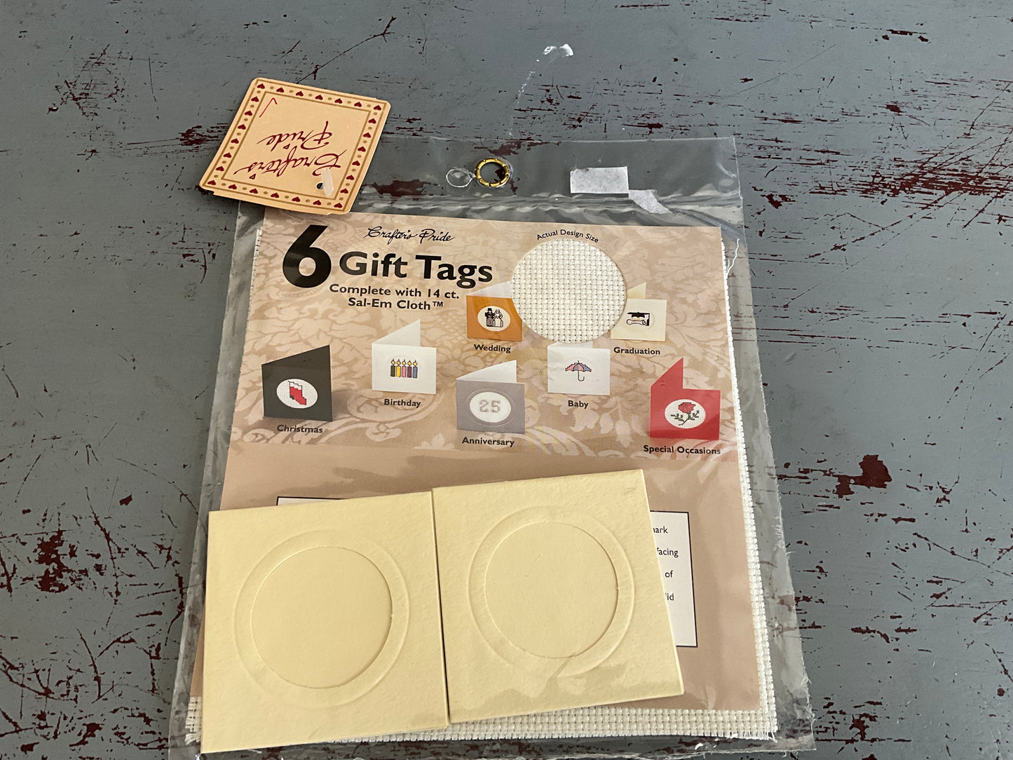 Crafter’s Pride 6 cross switchable gift tags on 14 count Salem cloth
