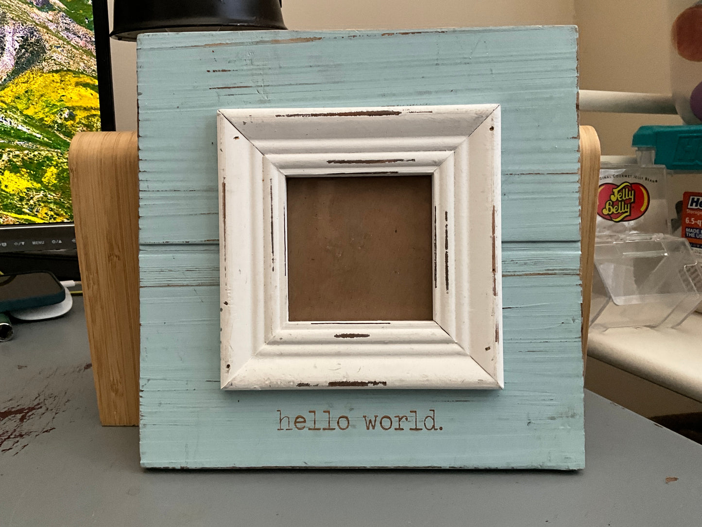 Mudpie “hello world” baby picture wall hanging frame 8” square frame that fits a 3” square picture.