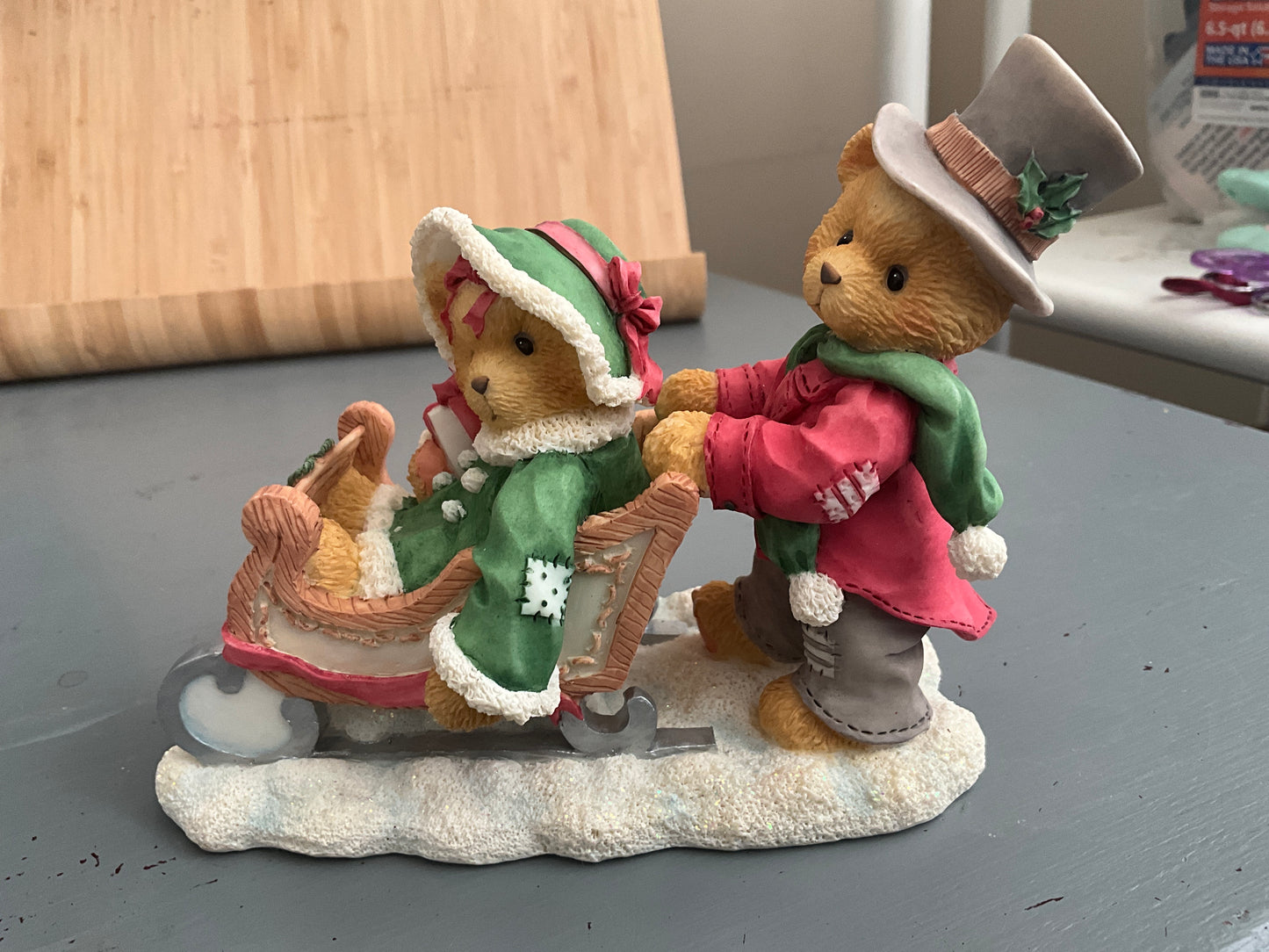 Cherished Teddies Lindsey and Lyndon walking in a winter wonderland boy pushing a girl in a sleigh figurine