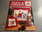 Leisure Arts Santa & Company and Santa’s Great Book set of 2 Christmas counted cross stitch charts