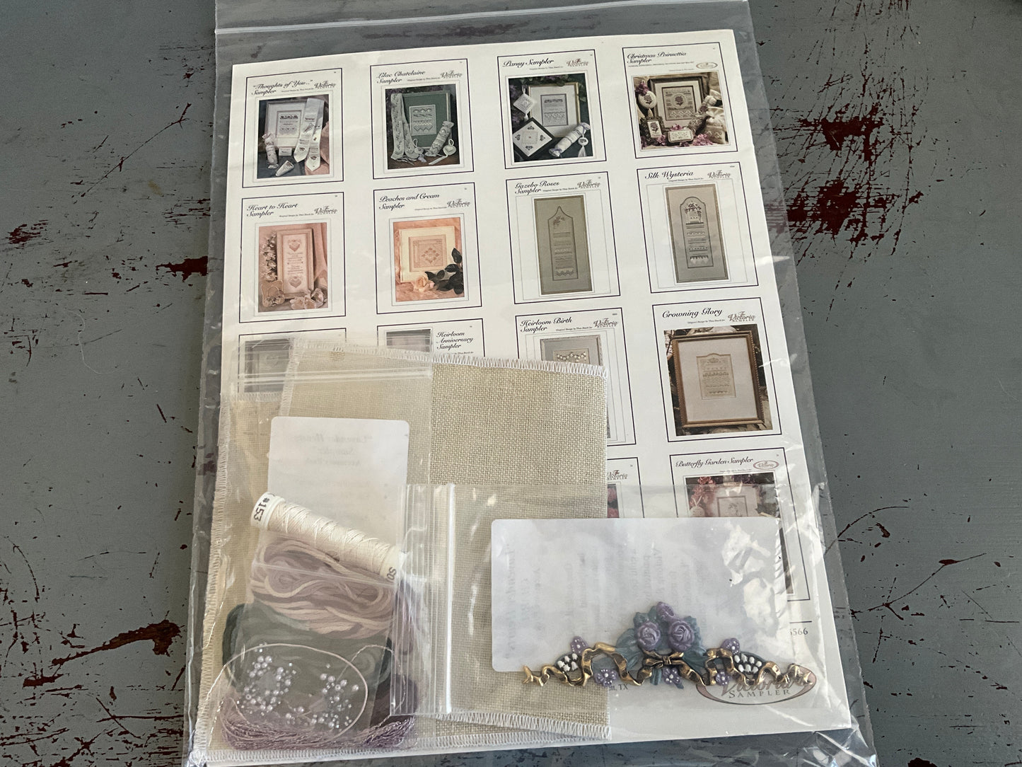 The Victoria Sampler Lavender Hearts Sampler Kit with fabric & embellishments