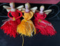 A trio of terrific tassel angels with porcelain heads gold family wings and floss bodies