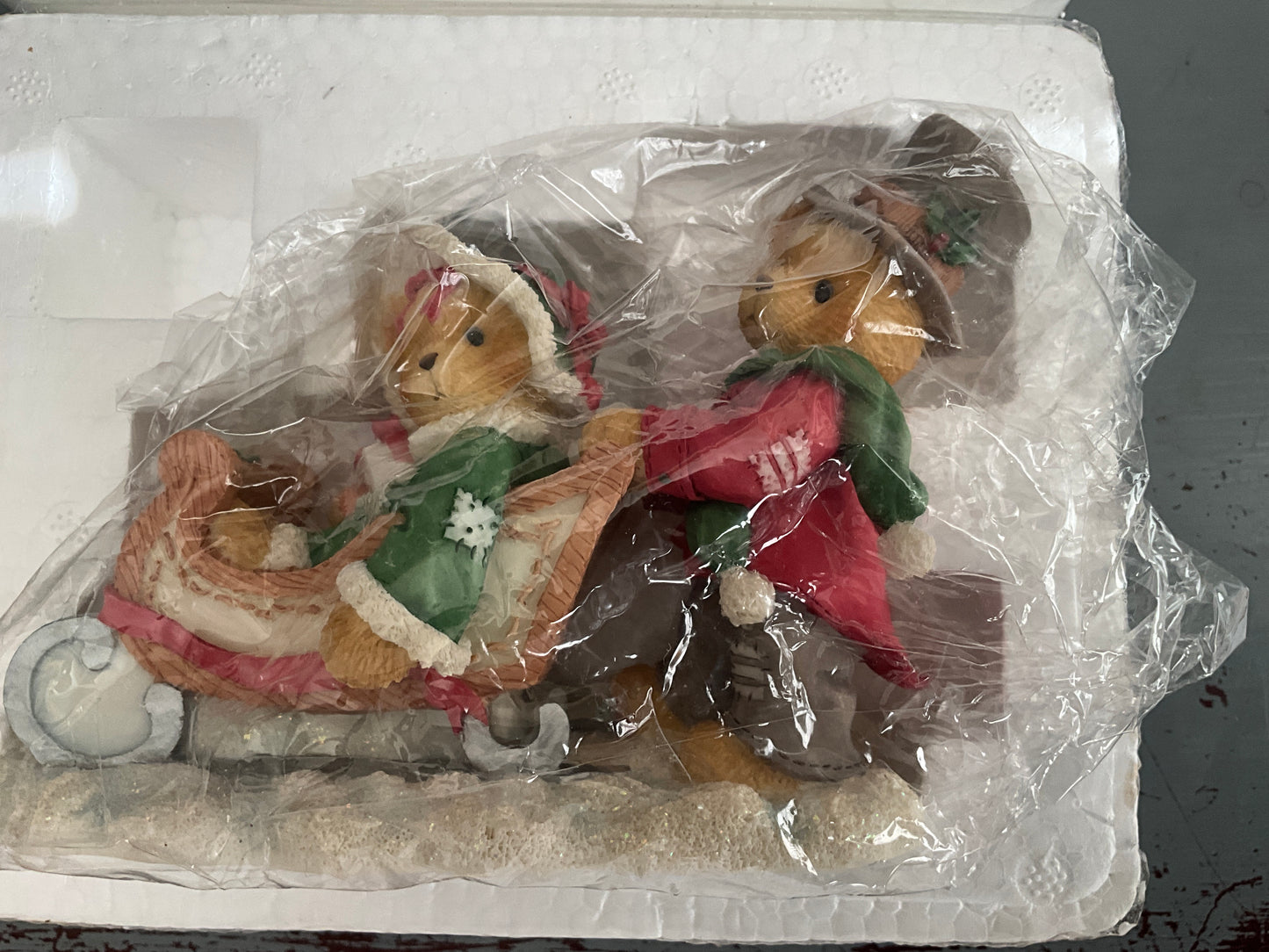Cherished Teddies Lindsey and Lyndon walking in a winter wonderland boy pushing a girl in a sleigh figurine
