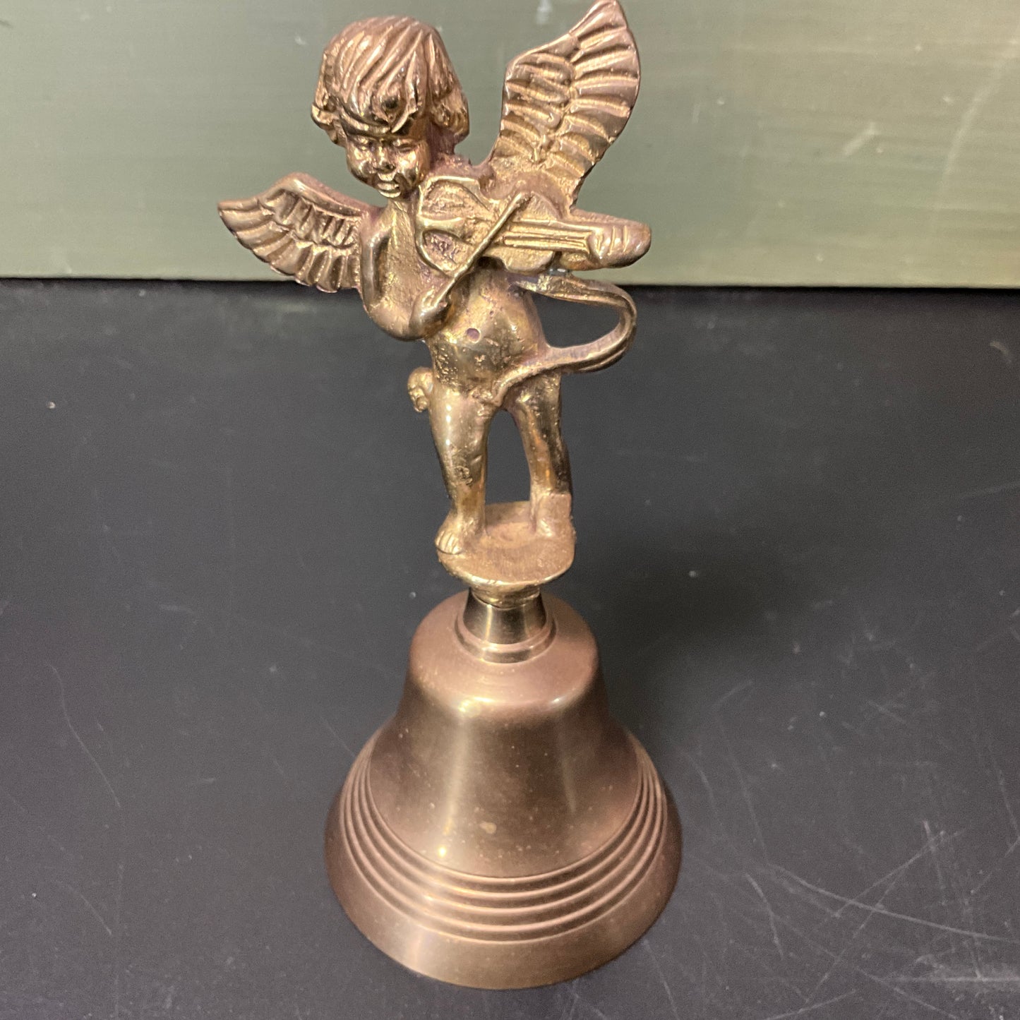 Captivating Cupid playing his harp vintage brass bell