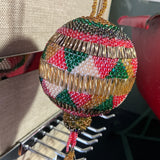 Beautiful handmade beaded round ornament with hanging star tassels
