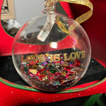 Pottery Barn Love Is Love clear glass Christmas ornament filled with multicolored hearts!