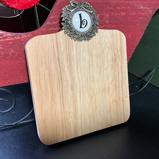 Cute cutting board with beautiful brass wreath medallion embellished with a b cross stitch finishing button wall hanging