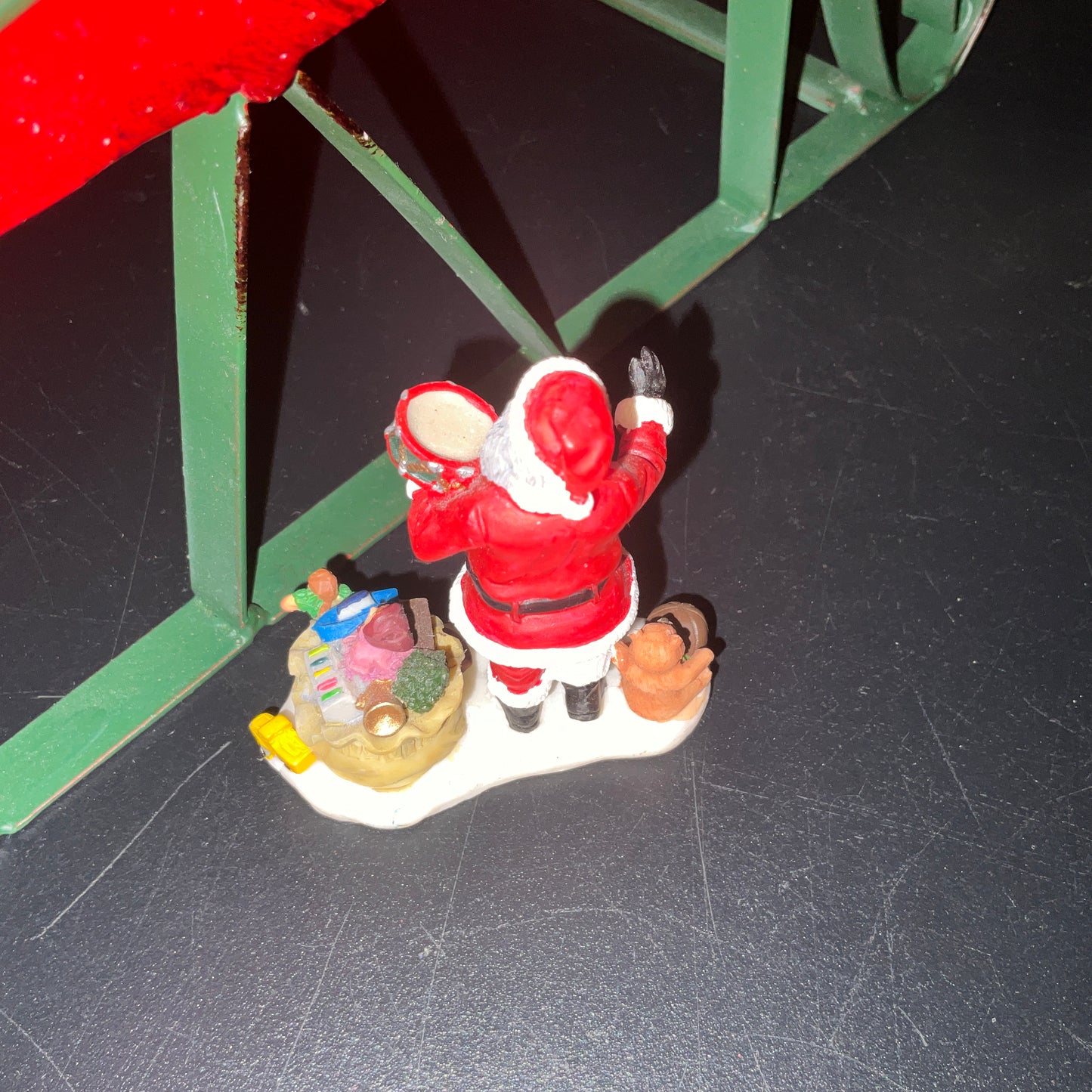 Lemax Santa Claus holding a little toy drum next to his sack of toys collectible figurine