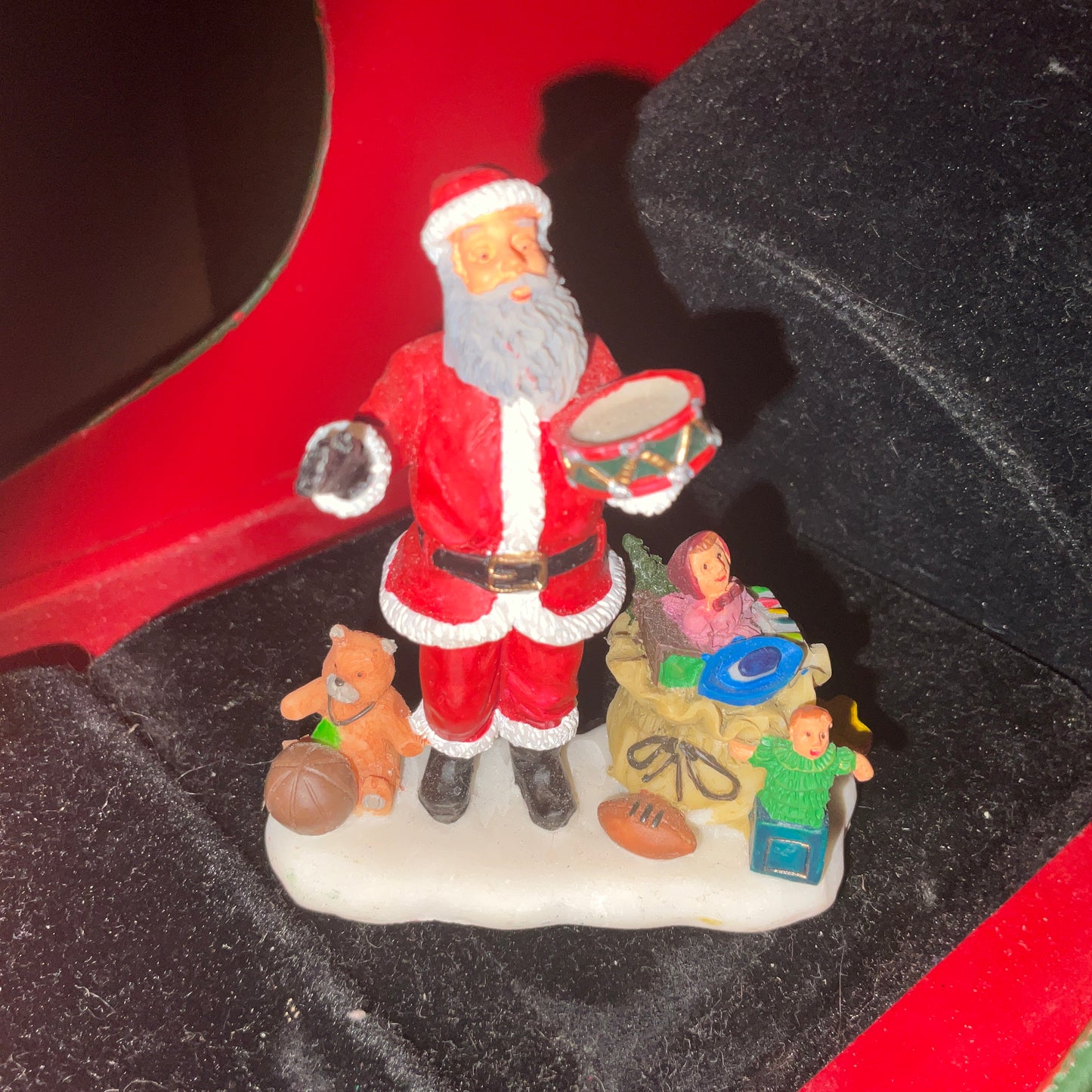 Lemax Santa Claus holding a little toy drum next to his sack of toys collectible figurine