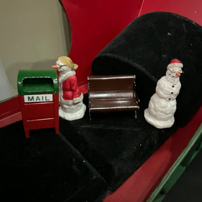 Lemax Santa Claus holding a little toy drum next to his sack of toys collectible figurine