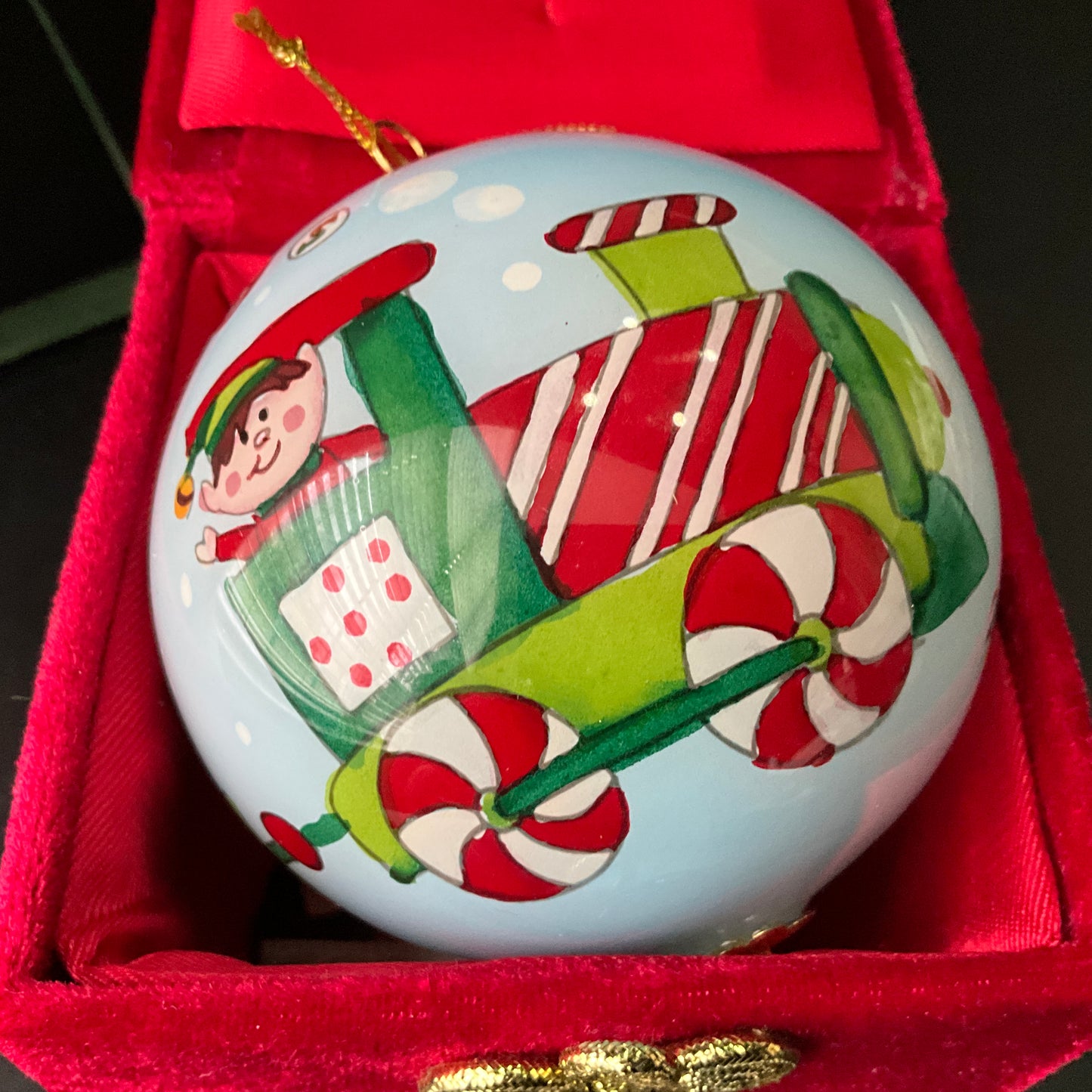 Pier 1 Li Polen Greetings 2012 painted and glazed ornament in ornate red felt box