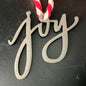 JOY lazer cut steel cutout Christmas ornament on a rope