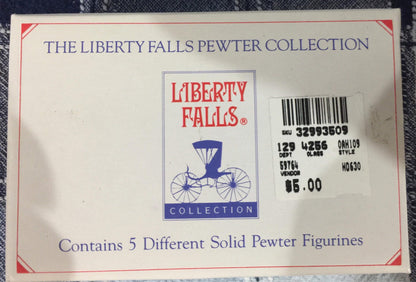 The Liberty Falls Solid Pewter Collection of 5 figurines of a timber wagon and 4 pioneers w/ history booklet vintage collectible