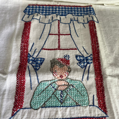 Little girl saying her prayers in front of a beautiful window vintage hand embroidered tea towel