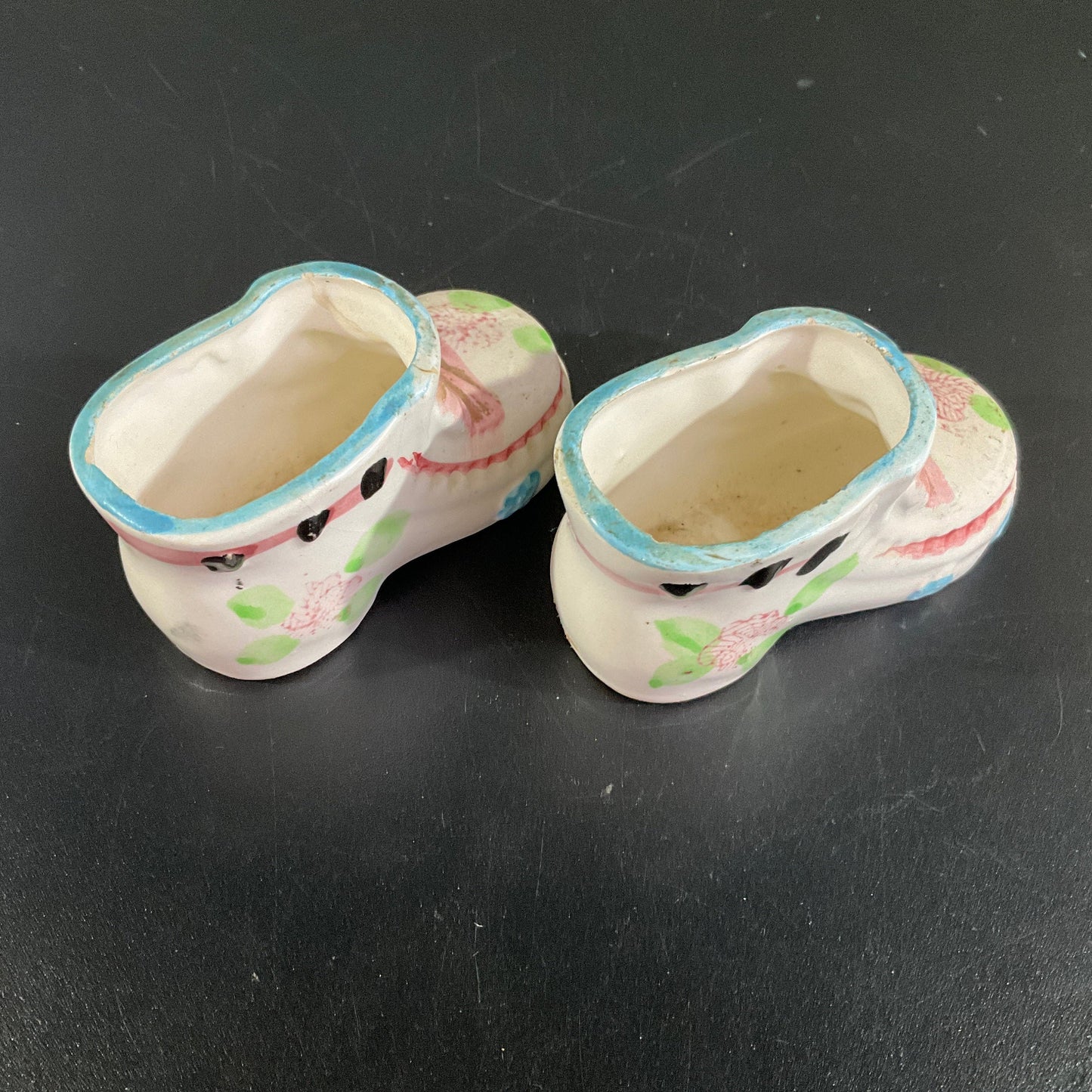 Precious porcelain pair of baby booties witj pink bows and blue trim vintage collectible figurines