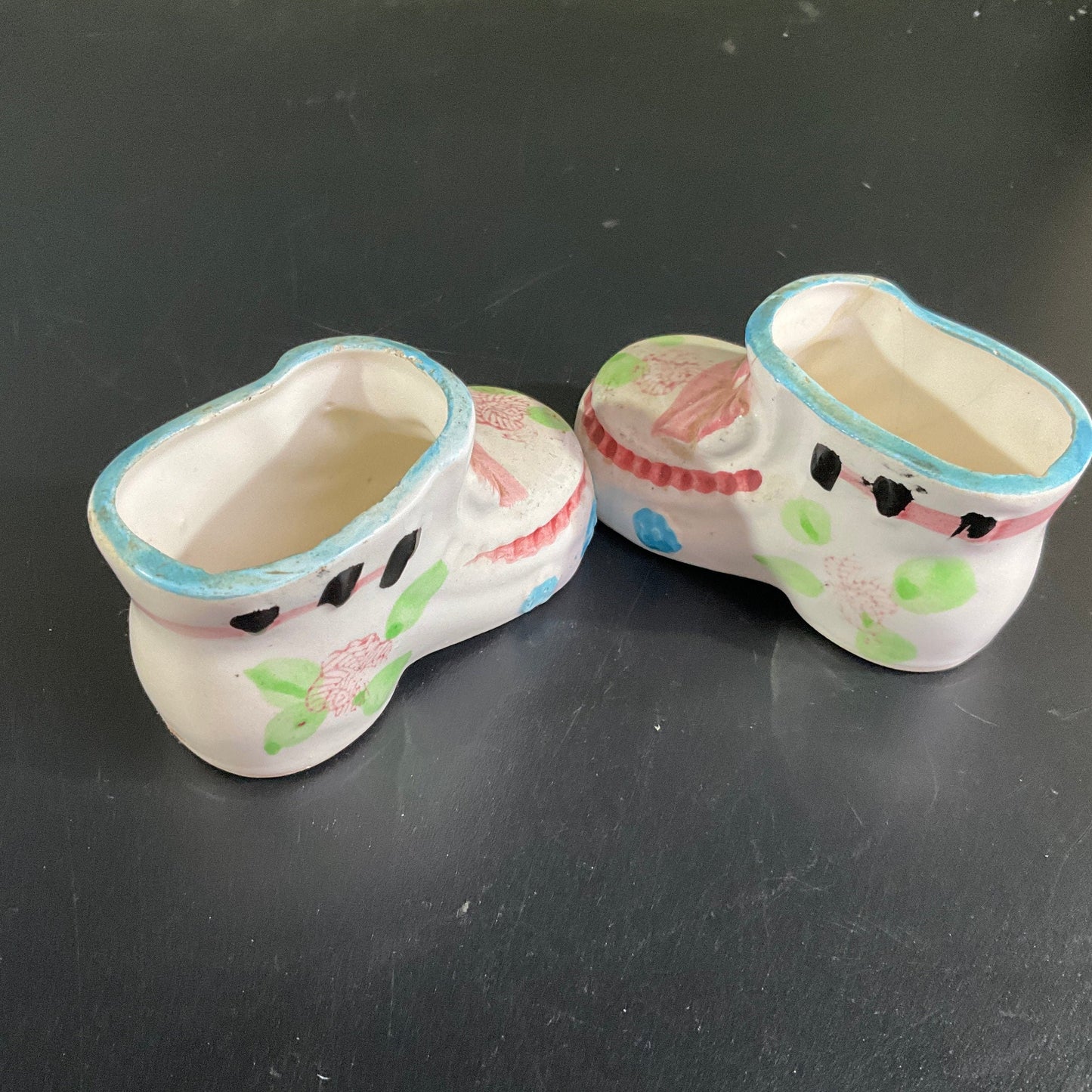 Precious porcelain pair of baby booties witj pink bows and blue trim vintage collectible figurines