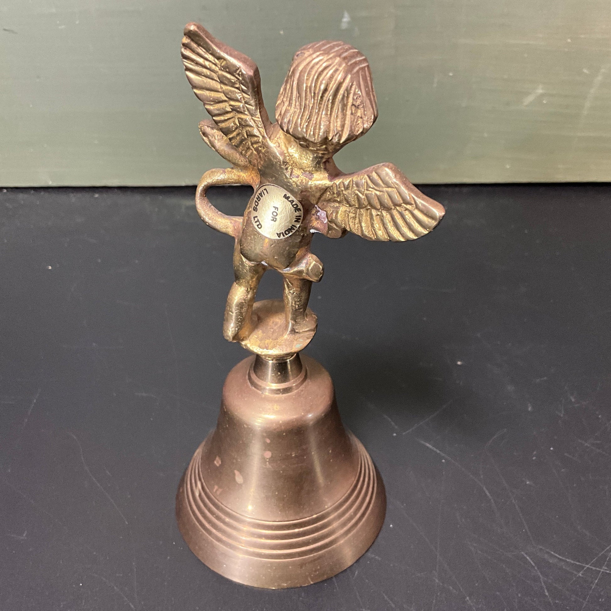 Captivating Cupid playing his harp vintage brass bell