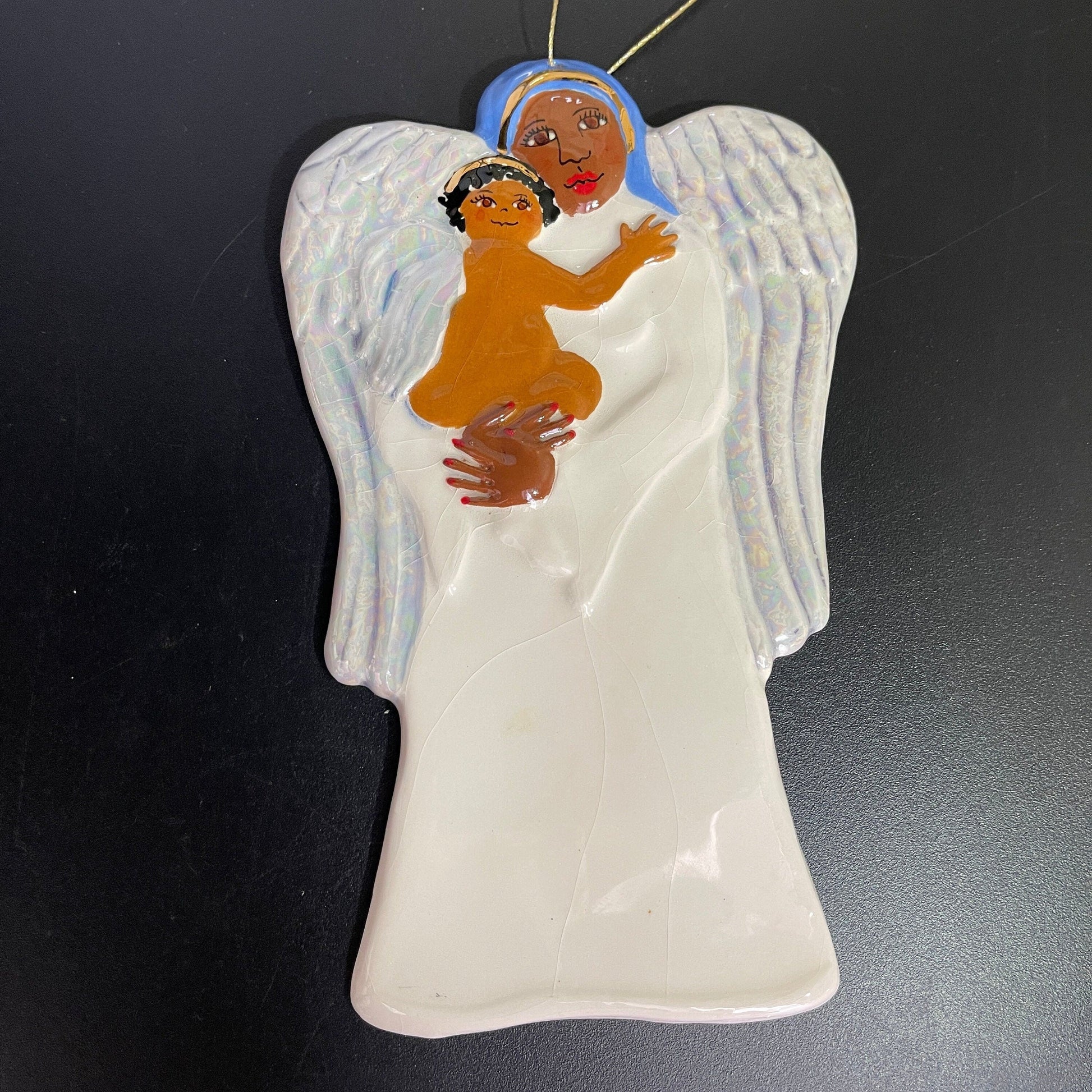 Angel holding Angel child 7 inch tall painted and glazed ceramic vintage ornament