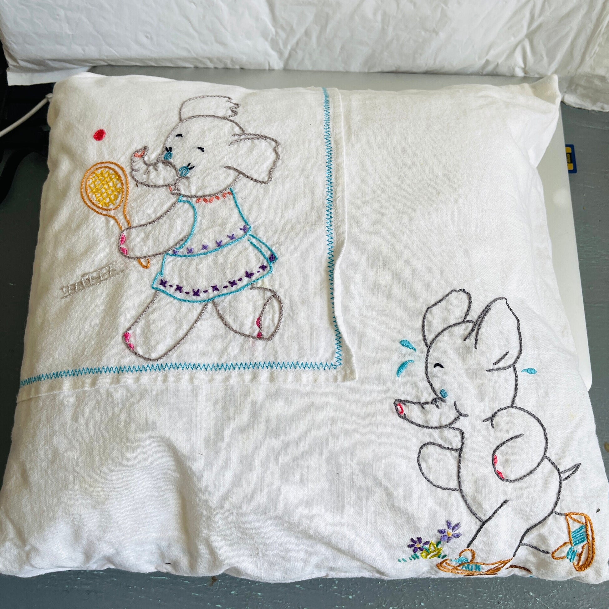 Elephants running and playing tennis, vintage hand embroidered pillowcase