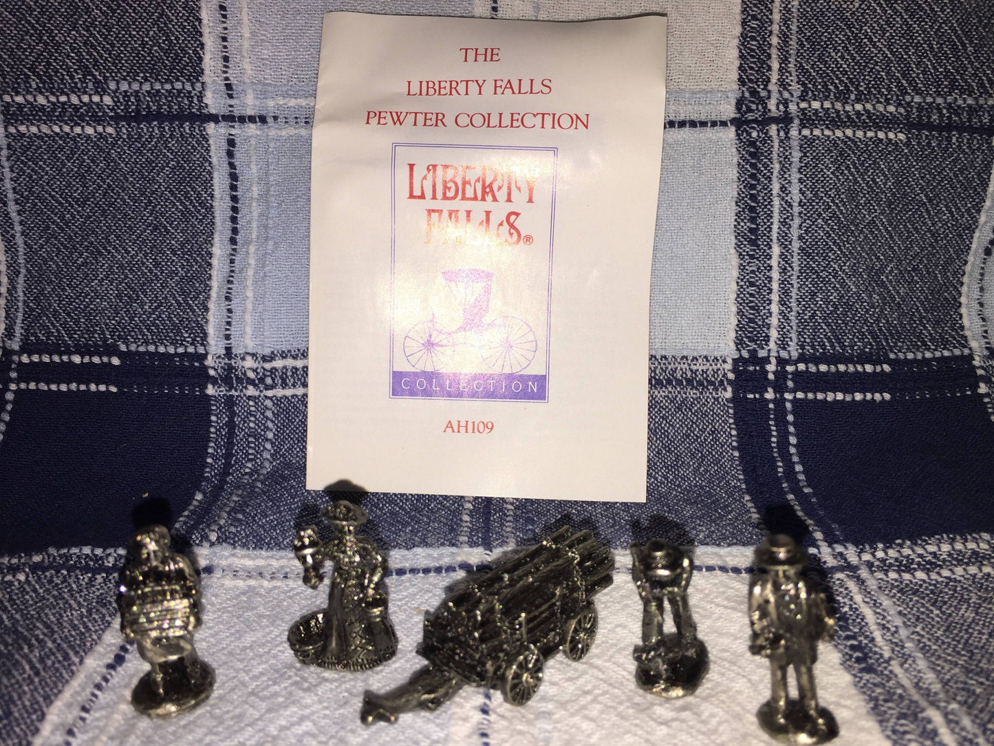 The Liberty Falls Solid Pewter Collection of 5 figurines of a timber wagon and 4 pioneers w/ history booklet vintage collectible