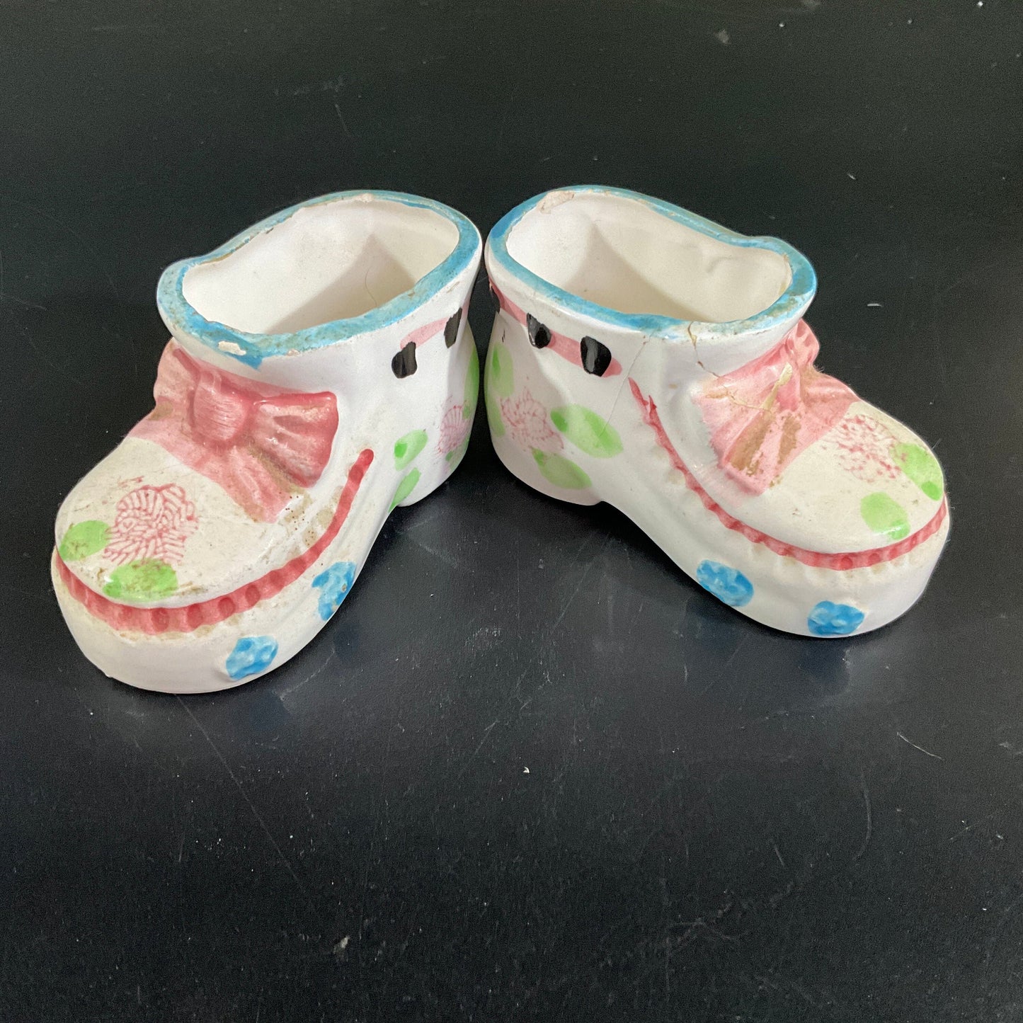 Precious porcelain pair of baby booties witj pink bows and blue trim vintage collectible figurines