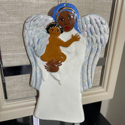 Angel holding Angel child 7 inch tall painted and glazed ceramic vintage ornament