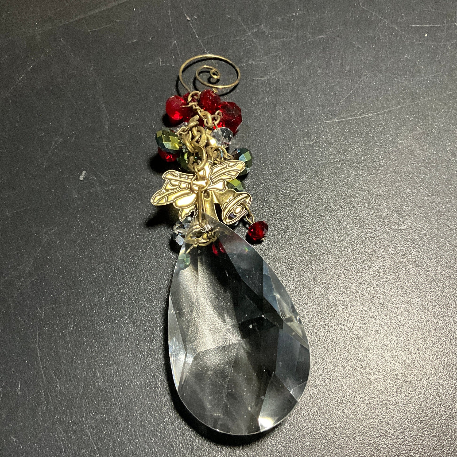 Charming crystal teardrop with gold-tone bell medallion and red & clear crystal berries fancy swirl hook ornament