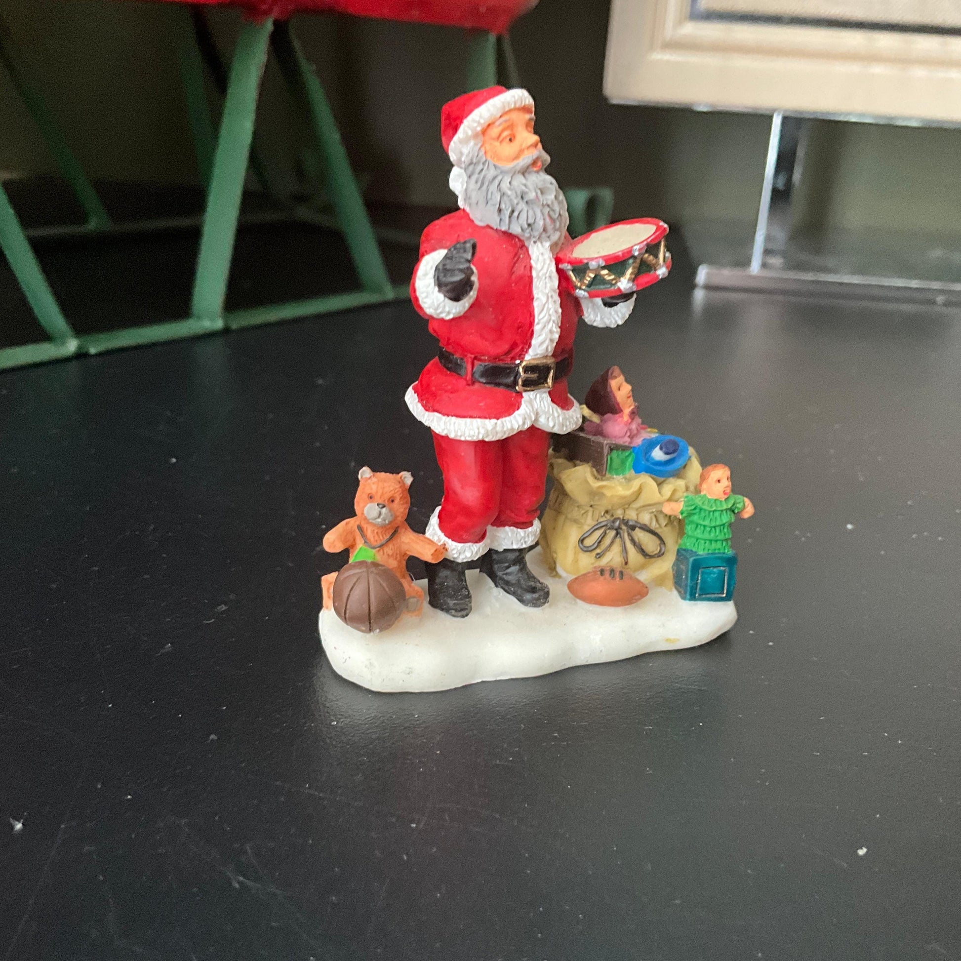 Lemax Santa Claus holding a little toy drum next to his sack of toys collectible figurine