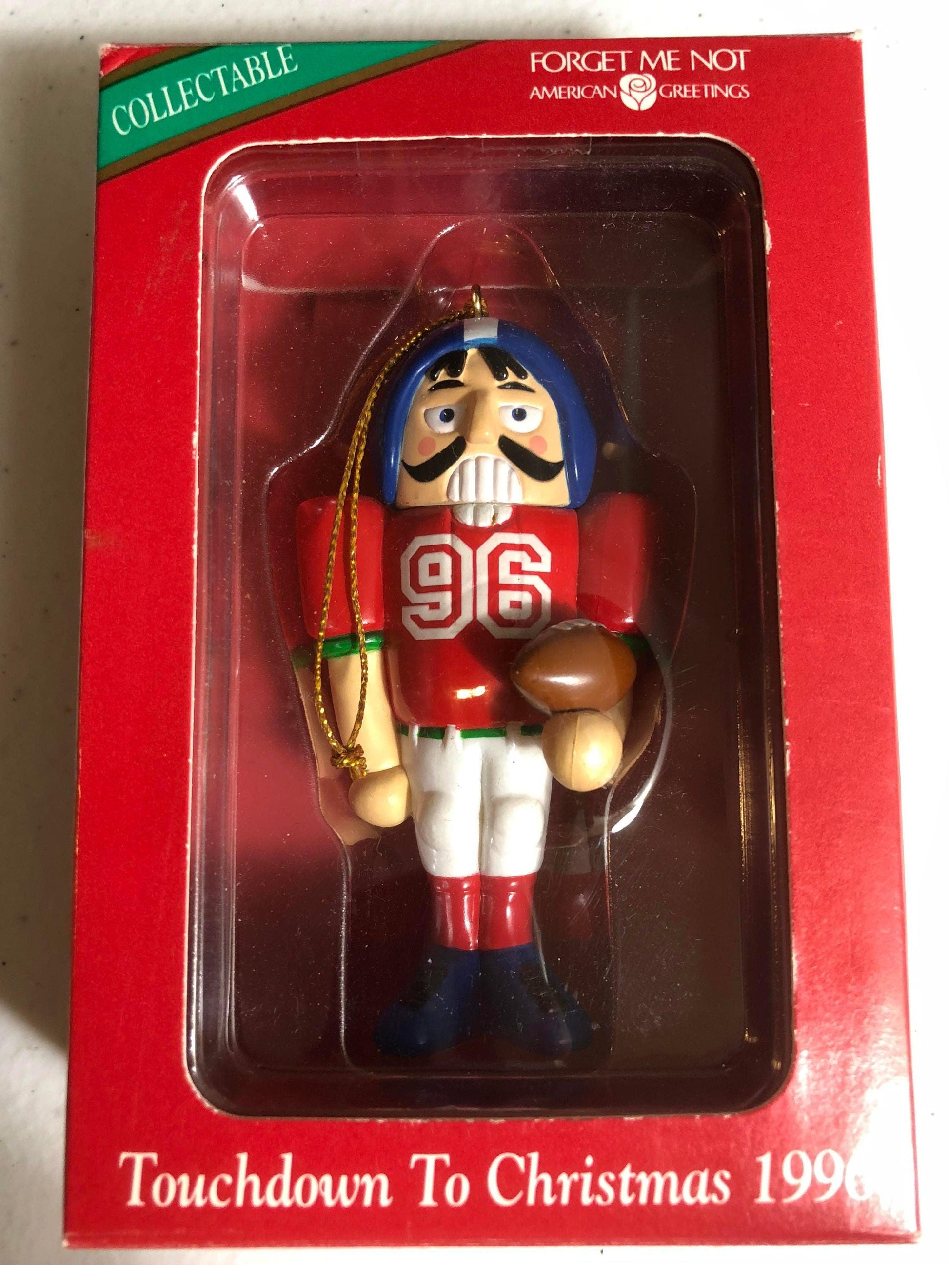 American Greetings Nutcracker Touchdown to Christmas Dated 1996 Forget Me Not Ornament