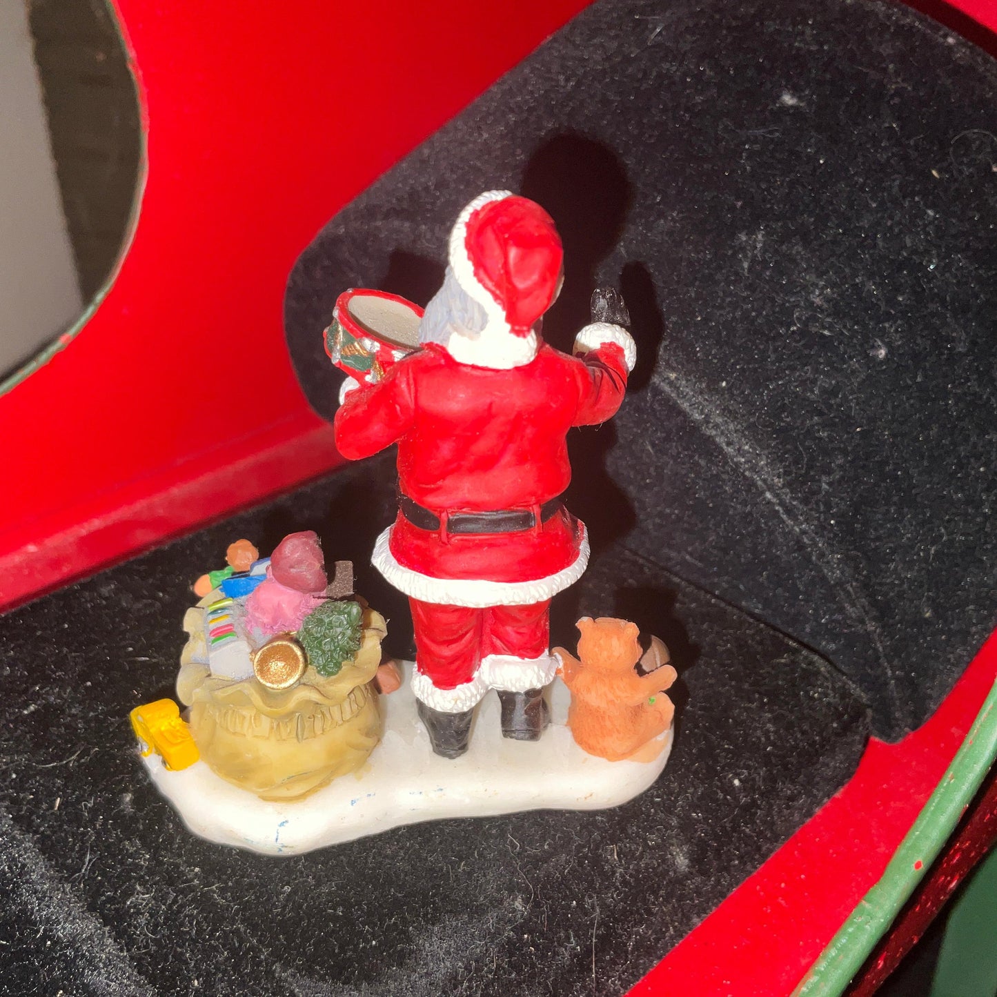 Lemax Santa Claus holding a little toy drum next to his sack of toys collectible figurine