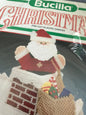 Bucilla Christmas Up the Chimney Centerpiece/Doorstop plastic canvas kit