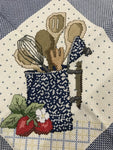 Completed counted cross stitch design crock holding kitchen utencils