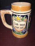 Small Beer Stein depicting couple drinking with the words Trink was klar ist (drink what is clear) Lieb was rar ist (loving what is scarce)