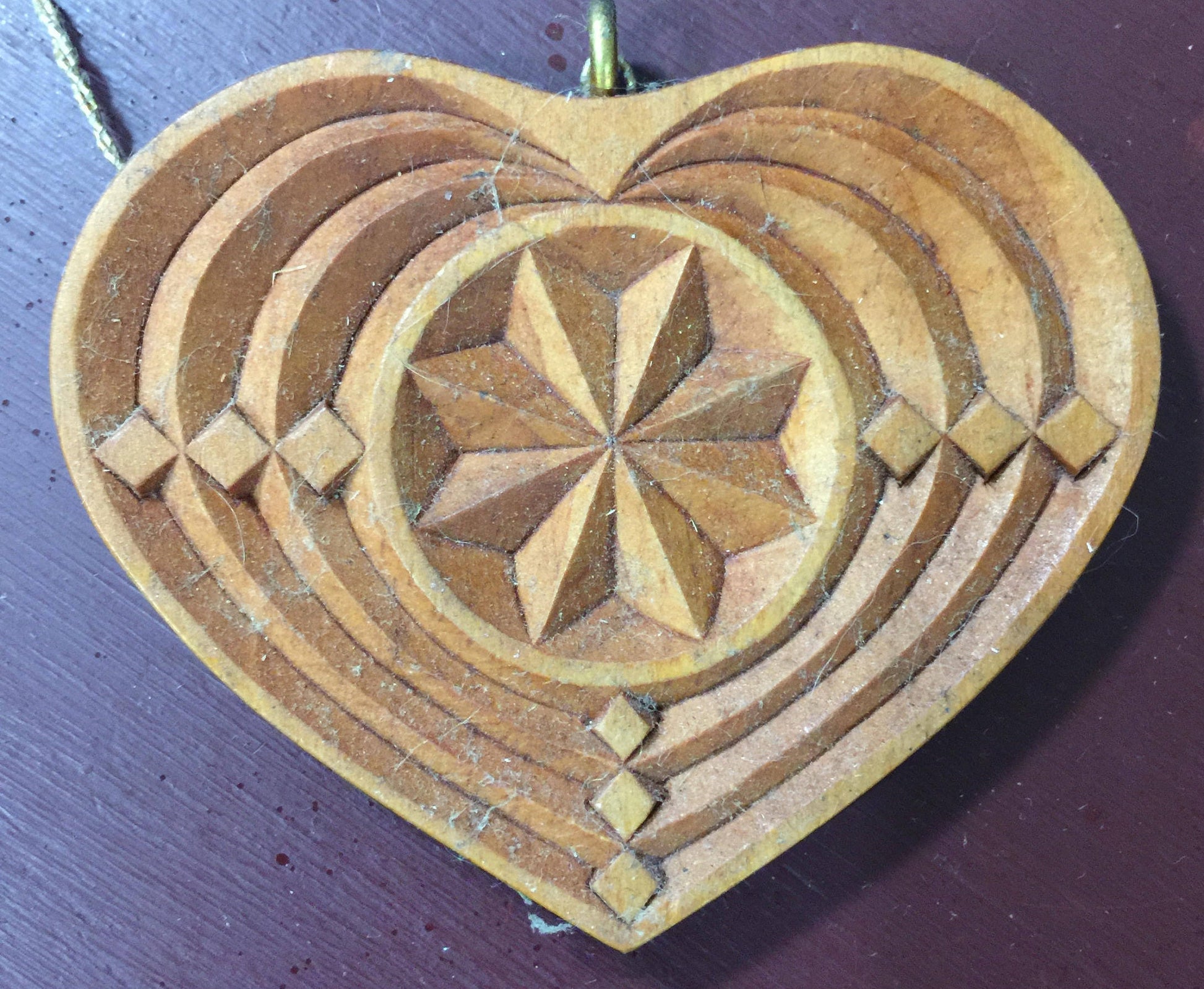 Carved wood ornament signed by M. Stryker, Vintage 1995
