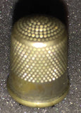 Vintage Collectible thimble has the number 10 and an interesting pattern and the bottom engraved into it