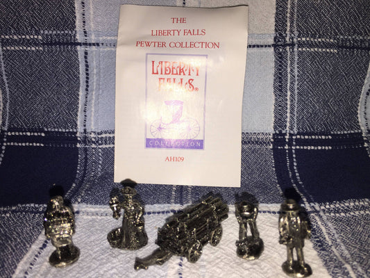 The Liberty Falls Solid Pewter Collection of 5 figurines of a timber wagon and 4 pioneers w/ history booklet vintage collectible