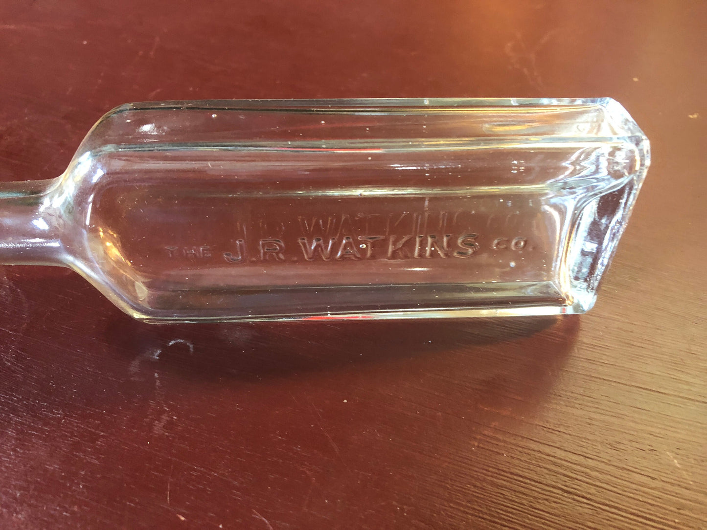 The J.R. Watkins, Vintage Collectible Clear Rectangular, Liniment Bottle with matching metal screw cap imprinted with Watkins