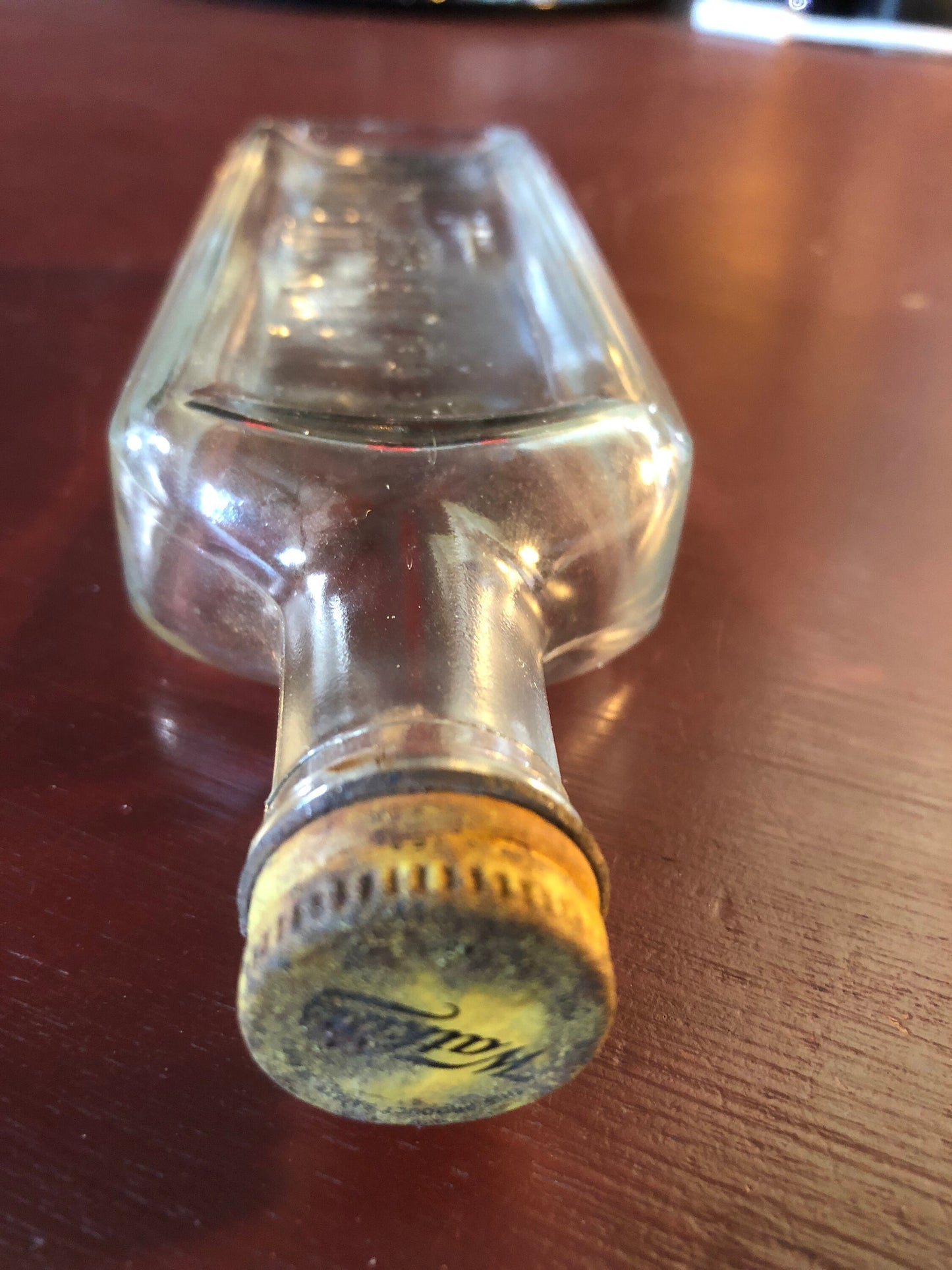 The J.R. Watkins, Vintage Collectible Clear Rectangular, Liniment Bottle with matching metal screw cap imprinted with Watkins