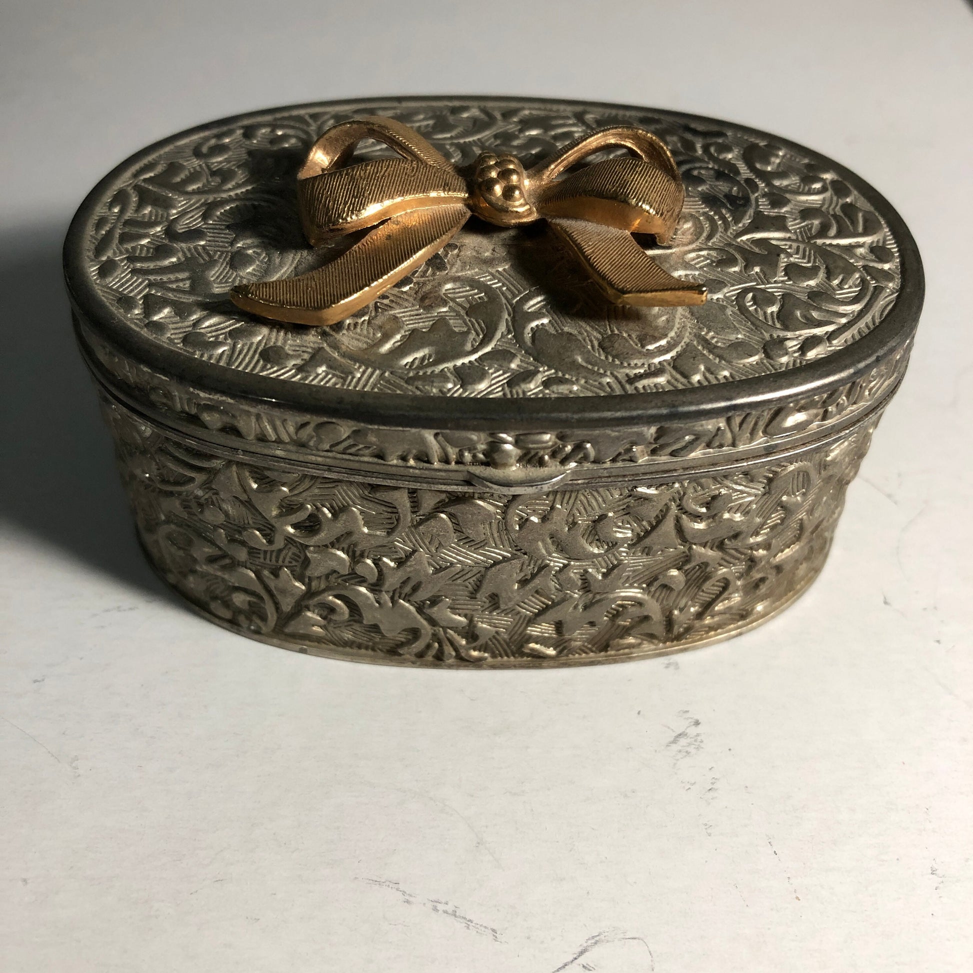 Pretty Ornate Silvertone with Gold Tone Ribbon On Lid Metal Ring/Jewelry Box with Lining